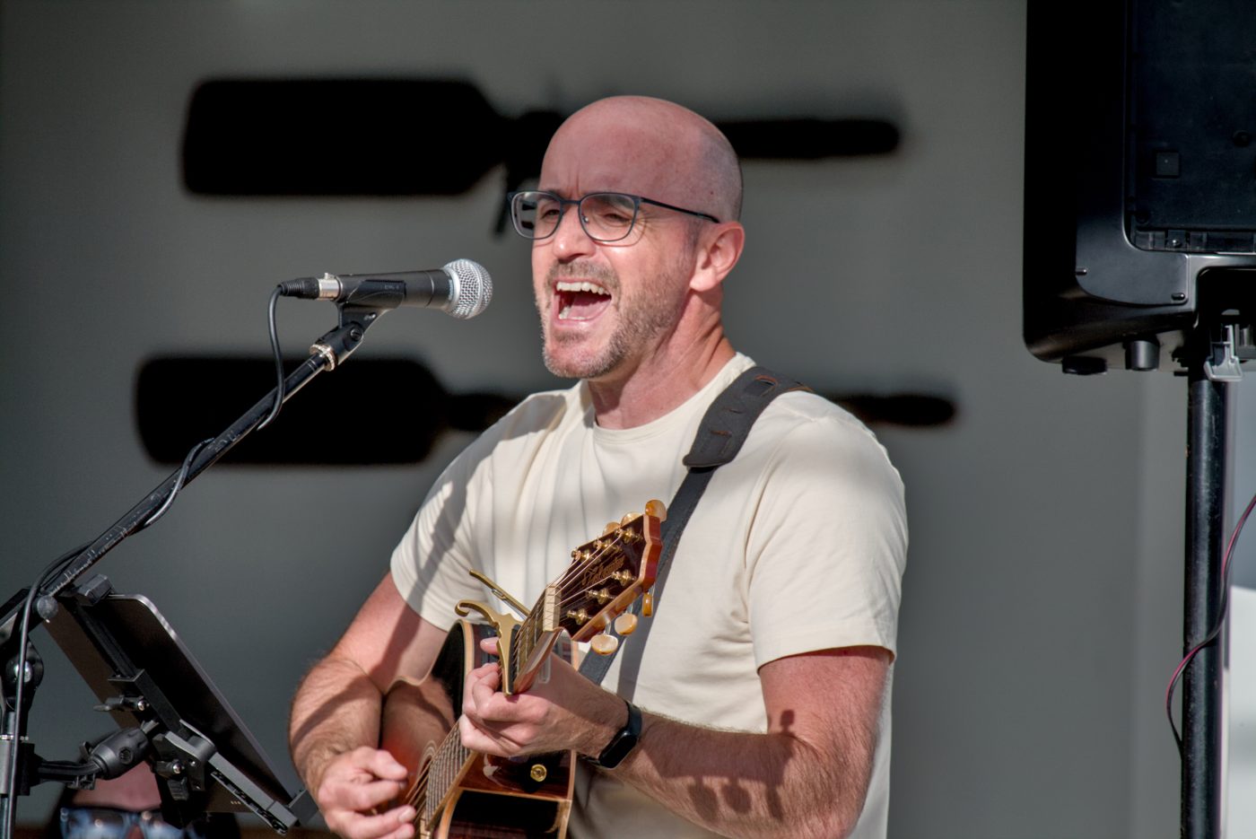 Colin laughing at the mic at Britannia Brewing
