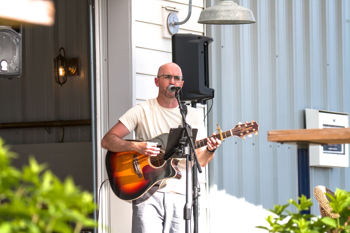 Colin playing on the patio at Britannia Brewing